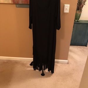 This is a little black dress with fringes on the bottom.